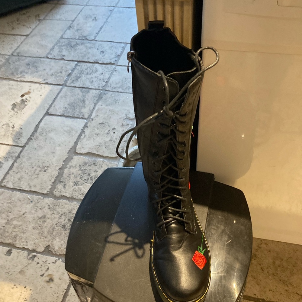 Brand new tie up boots with zipper on side with embroidered red roses.